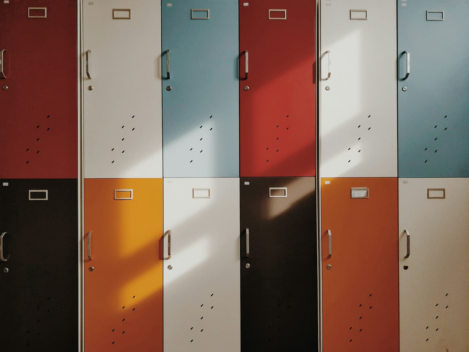 Rows of retro lockers in red, white, blue, and orange