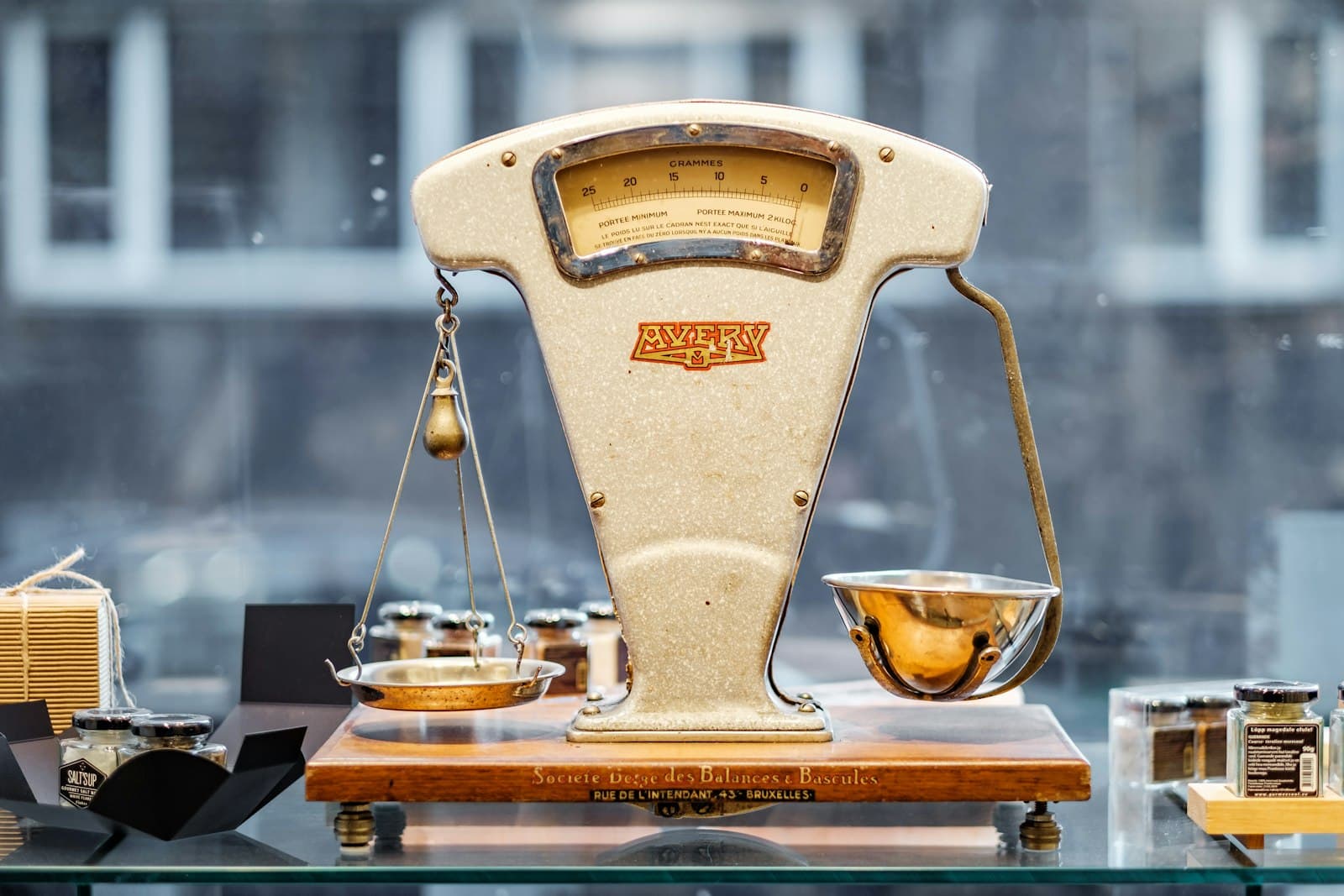 Vintage two-pan balance scale on a shop counter